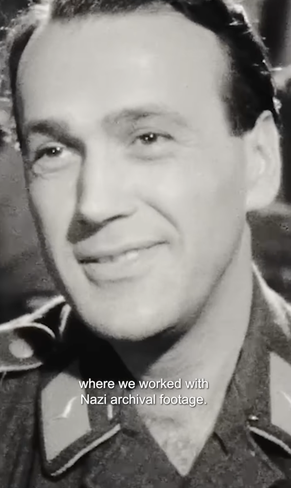 Image of nazi soldier looking into the camera, smiling